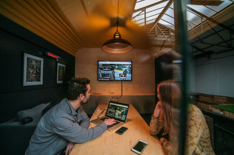 people in meeting pod